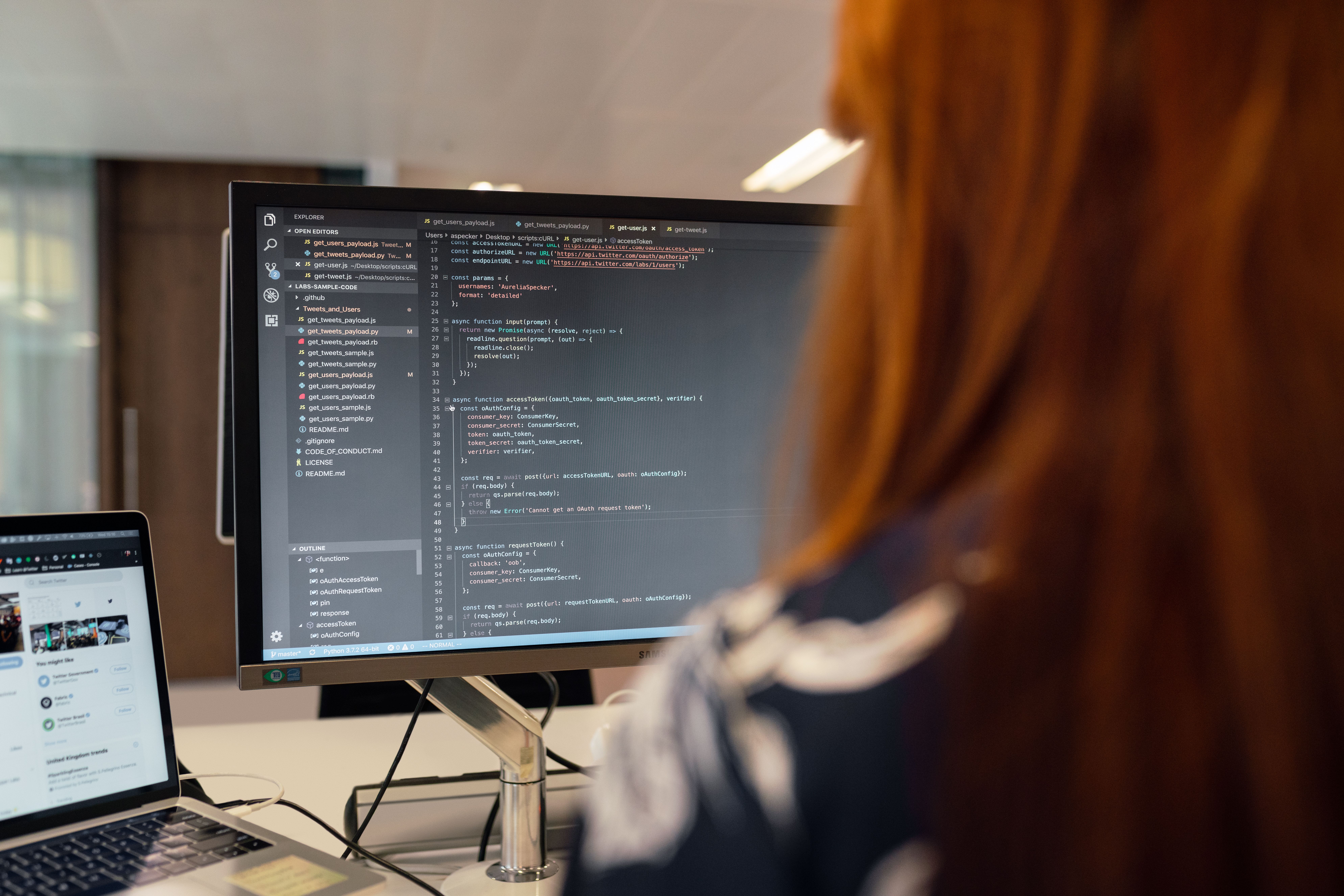 Software engineer working with code in a contemporary office, representing the human review behind test results.